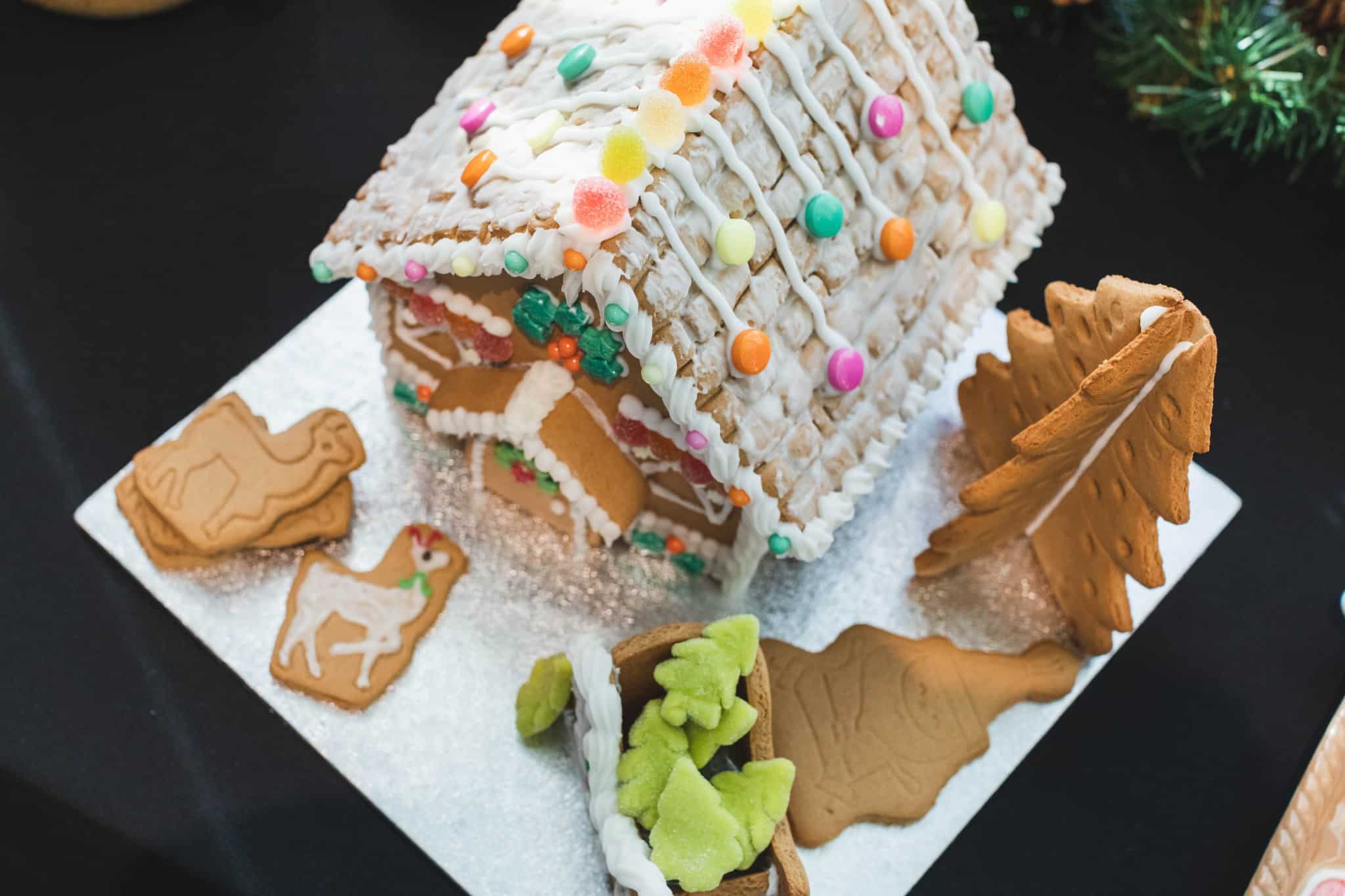 Decorated gingerbread house with biscuits and icing