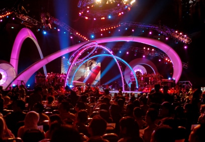Large concert or conference stage production with complex lighting design and a large audience.