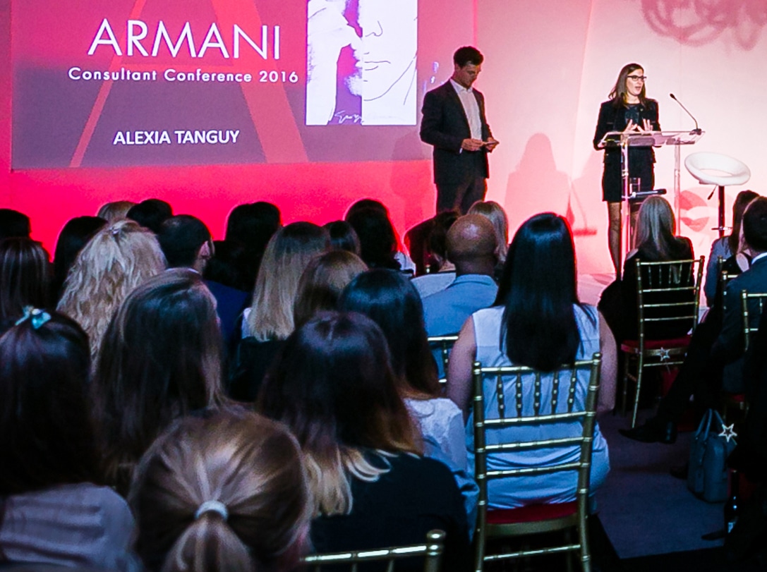 Business conference presentation with keynote speakers on stage