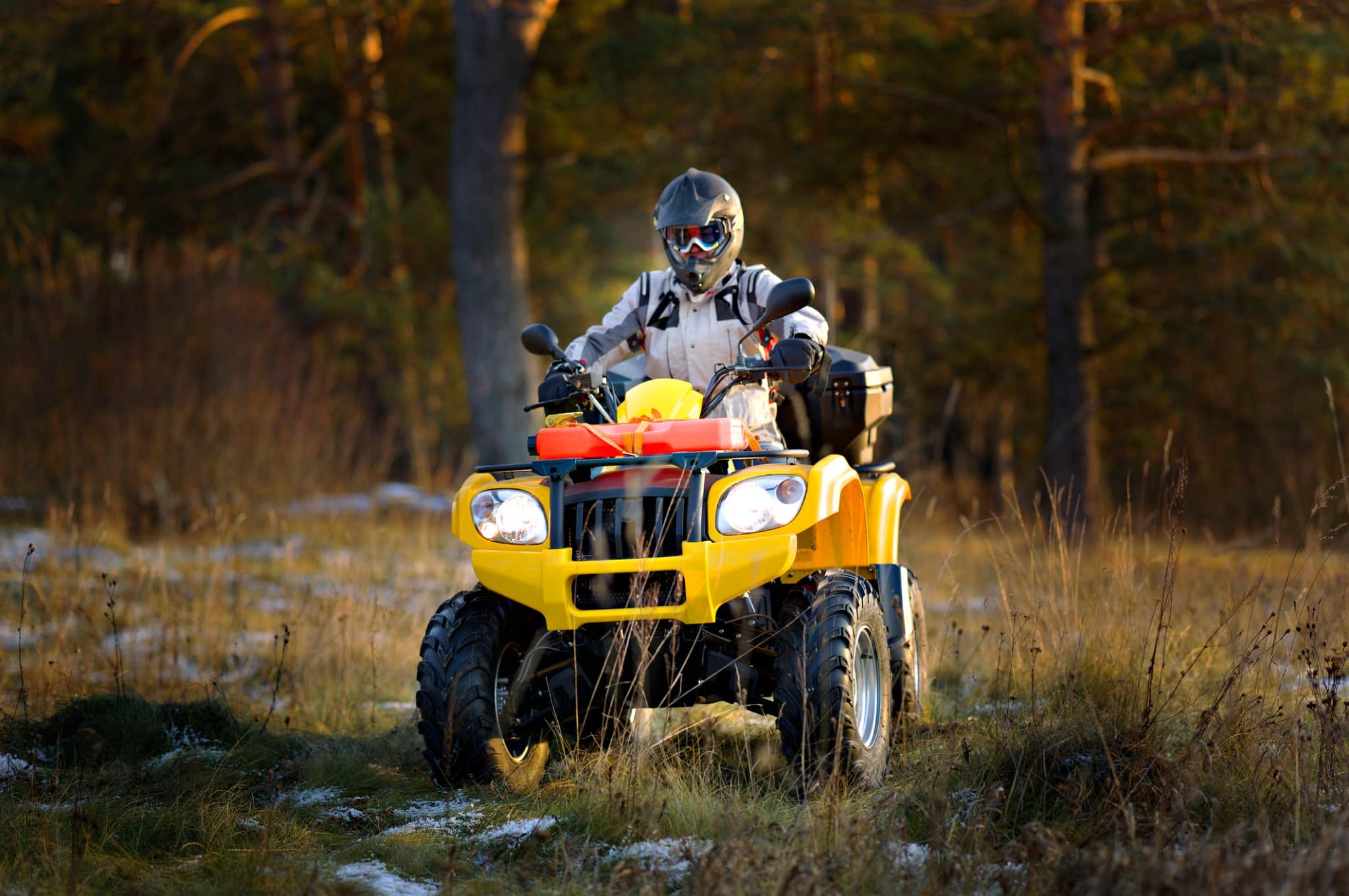 Person riding quad bike during outdoor adventure team building event