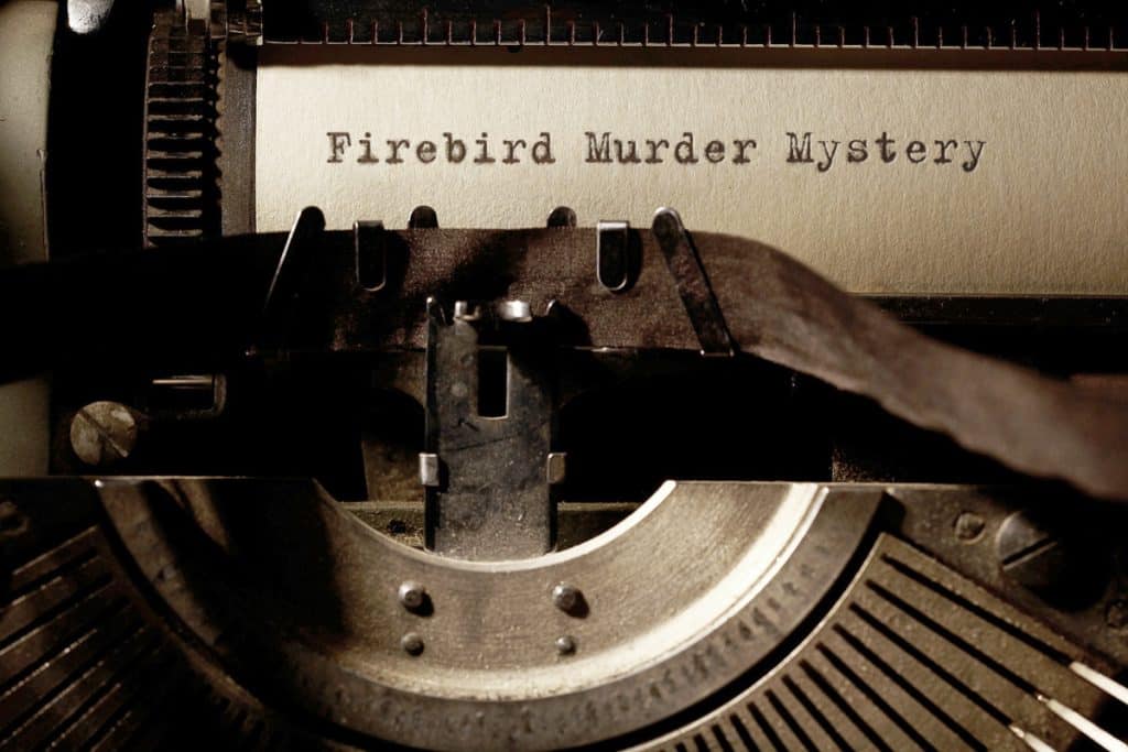 Typewriter with “Firebird Murder Mystery” title