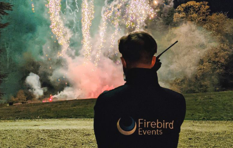 Fireworks technician controlling outdoor pyrotechnic display